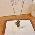Close-up detail of an exquisite natural stone grape cluster pendant on a silver chain - Silver Grape Water Drop Cube Necklace / 70cm / Tiger Eye