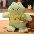 Peluche de rana verde sonriente con suéter amarillo y pequeño bolso beige - Suéter Amarillo con Paraguas / Longitud total 30cm, altura sentada 26cm