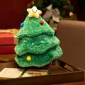 Green plush Christmas tree toy with a smiley face and a yellow star topper on a tray - Tiered Christmas Tree With Apple Style (28cm)