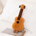 Adorable orange guitar shaped plush toy featuring a cute smiley face and striped legs - 38 cm / Guitar