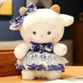 Soft and cuddly lamb plush doll wearing a blue starry print dress and matching bow tie. - Royal Blue Star Moon Dress