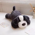 Soft and fuzzy plush grey and white dog pillow toy for kids in a lying down position - 30cm / Border Collie