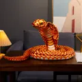 Realistic cobra snake plush toy in a coiled pose, ideal for pranks or zodiac gifts. - Orange Cobra