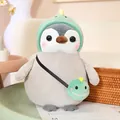 Peluche pingouin douce dans un costume de dinosaure vert mignon avec petit sac assorti - Manchot Dinosaure