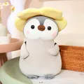Peluche suave de pingüino variante con una decoración de sombrero de flor amarilla - Pingüino Flor