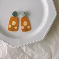 Quirky orange acrylic drop earrings with yellow floral pattern and grey studs for women - Orange Base Yellow Floral