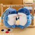 Detailed close-up of two cute blue shark plush keychains on a wooden stand - 15cm / Blue Whale Style