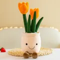 Dettaglio di un peluche creativo a forma di tulipano con una faccina sorridente - Arancione / 35cm