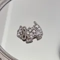 Close-up of pearl and crystal encrusted dog shaped hair clip with elegant bow detail - Pearl Bow - Dog Clip