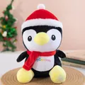 Close-up of a festive penguin plush toy wearing a Santa hat and a bright red scarf. - Christmas Penguin