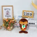 Detailed macro view of a cute brown walrus plush toy holding a small colorful ball - Brown Walrus Holding Ball / 23cm / Brown
