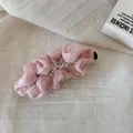 Close-up detail of a pink ruffled chiffon hair clip with delicate pearl beads embellishment - Pleated Pearl Banana Clip / Pink