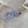 Detail shot of a lavender pleated chiffon hair clip with pearl embellishments - Pleated Pearl Banana Clip / Blue