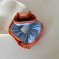 Close-up of a stylish Korean zipper scrunchie with light blue fabric and orange zipper - Zipper Scrunchie / Blue Orange