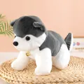 Detail view of a cute husky plush toy dog with a gold bell accessory on a woven mat. - Gray / 30cm