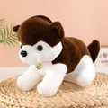 Close-up of a cute husky plush toy with a golden bell sitting on a woven mat - Dark Brown / 30cm
