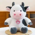 Soft and fluffy black and white stuffed cow plush toy featuring a pink heart tag - Sitting Cute Cow / 23cm