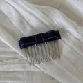 Detailed macro view of a dark blue denim bow hair comb on a textured beige linen background - Dark Blue Denim - Double Layer Bow Hair Comb