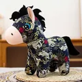 Full side view of a Chinese style zodiac horse plush toy with traditional floral patterns on a mat - Black Koi Horse