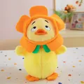 Close-up of cute yellow duck plush toy wearing an orange flower hat and green bow tie - Sunflower Duck / 22cm
