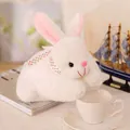 Detailed shot of a soft white plush bunny toy featuring a pink polka dot ribbon - 25cm / White