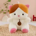 Close-up of a cute sitting plush cat toy with pink ears and calico patches - Calico Cat / 23cm