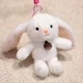 Detailed view of a cute white plush rabbit keychain with long ears and fashion tag - Hanging Leg Rabbit / 16cm (With Lanyard)