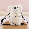 Detailed front view of a cute white plush koala-shaped crossbody bag sitting on a mat - Simulation Koala Bag