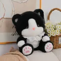 Adorable black and white tuxedo cat plush toy with lace collar and pink paw pads sitting. - 23cm / Black