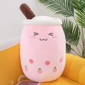 Soft pink strawberry milk tea cup plush pillow featuring a cute embroidered smiling face - Height 24cm / Pink Squinting