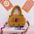 Detail view of a cute brown plush capybara handbag with embroidered facial features - Capybara Shape Crossbody Handbag / Height 22cm / Brown