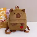 Close-up detail of a cute brown plush capybara backpack with small apple embroidery - Apple Embroidery Capybara Bag / 25cm