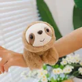 Detailed view of a cute plush sloth slap bracelet worn on a child's wrist. - Sloth Shape / 15cm / Tan