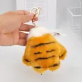 Detail of plush tiger paw keychain with soft orange fur and gold metal clasp. - 12cm / Yellow