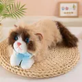 Close-up of lifelike Ragdoll cat plush toy with blue eyes and a silk bow tie - Tan / 45cm (Small)