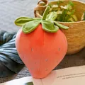 Macro view of a soft strawberry plush toy showing delicate embroidery and texture - Pink / 20cm