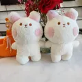 Close-up view of two white plush rabbit dolls with pink ears and soft sherpa fabric texture - White Rabbit / 22cm