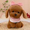 Close-up detail of a soft plush brown puppy dog toy featuring a pink bow and lace bib - Dark Brown / 23cm