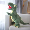 Morbido e simpatico peluche a forma di dinosauro Tirannosauro Rex verde sul divano - Verde / 29cm