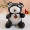Close-up of a small black and white plush bear toy with a leather neck tag - Black and White Schnauzer / 23cm