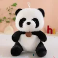 Front view detail of a fluffy panda plush doll with a decorative neck tag - Panda / 23cm