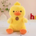 Close-up of a cute yellow plush duck with soft fur and an orange beak detail - Yellow Duck / 23cm