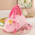 Close-up view of a cute pink plush capybara barrel bag with a knitted flower detail. - Pig Style / 28cm