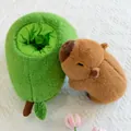 Adorable brown capybara plush toy resting inside a soft green fuzzy avocado plush nest - Capybara Avocado / 35cm