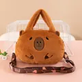 Adorable brown plush Capybara handbag featuring soft texture and custom patterned strap - Indifferent Capybara