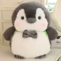 Close-up of a cute grey and white plush penguin with a bowtie and green backpack straps - 22cm (Without Blush) / Green Penguin Brother