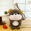 Detailed view of the cute brown bear plush toy pendant with strawberry props on a desk - Otter / 18cm (With Lanyard)