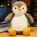 Cute grey and white penguin plush toy made of soft fabric sitting on a desk - 25cm / Dumpling Penguin