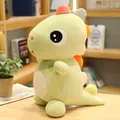 Adorabile peluche a forma di dinosauro verde con punte arancioni e grandi occhi neri tondi - Verde chiaro / 25cm