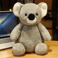 Adorable grey plush koala toy sitting on a desk, soft and cuddly stuffed animal gift - 25cm / Koala